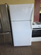 FRIGIDAIRE 18 CUBIC FOOT REFRIGERATOR TOP FREEZER GLASS SHELVES 2 CRISPER DRAWERS 1 DELI DRAWER FULL WIDTH WIRE SHELF IN FREEZER COSMETIC ISSUE IN DAIRY STORAGE SEE PIC WHITE LOCATED IN OUR PORTLAND OREGON APPLIANCE STORE SKU 23901