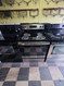 GE 30 INCH FREESTANDING ELECTRIC RANGE COIL BURNERS 2 LARGE 2 SMALL HI-LO BROIL SETTING SELF CLEANING OVEN STORAGE DRAWER BLACK STAINLESS LOCATED IN OUR PORTLAND OREGON APPLIANCE STORE SKU 23014
