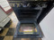 GE 30 INCH FREESTANDING GAS RANGE 4 BURNER MANUAL CLEAN OVEN BOTTOM BROILER BLACK AND STAINLESS LOCATED IN OUR PORTLAND OREGON APPLIANCE STORE SKU 23812