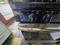 GE 30 INCH FREESTANDING GAS RANGE 4 BURNER MANUAL CLEAN OVEN BOTTOM BROILER BLACK AND STAINLESS LOCATED IN OUR PORTLAND OREGON APPLIANCE STORE SKU 23812
