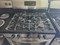 KENMORE FREESTANDING 5 BURNER GAS RANGE WARM AND HOLD SETTING SELF CLEANING OVEN BLACK ANS STAINLESS LOCATED IN OUR PORTLAND OREGON APPLIANCE STORE SKU 23823