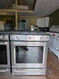 KitchenAid 30 Inch Slide-In Gas Range with 5 Sealed Burners, 5.8 cu ft. Even-Heat™ True Convection Oven, 17,000 BTU Burner, Storage Drawer, Steam Rack, Aqua Lift Steam Clean, ADA Compliant and Sabbath Mode: Stainless Steel SKU 24037