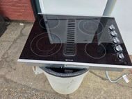 JENN-AIR 30 INCH DOWN DRAFT GLASS COOKTOP 4 BURNER 2 LARGE DUAL 2 SMALL BLACK LOCATED IN OUR PORTLAND OREGON APPLIANCE STORE SKU 24081