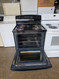 GE 30 INCH FREESTANDING ELECTRIC RANGE COIL BURNERS 2 LARGE 2 SMALL HI LO BROIL SETTING SELF CLEANING OVEN BLACK LOCATED IN OUR PORTLAND OREGON APPLIANCE STOE SKU 24085