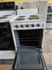 HOTPOINT 20 INCH FREESTANDING ELECTRIC RANGE MANUAL CLEAN OVEN COIL BURNERS 3 SMALL 1 LARGE WHITE LOCATED IN OUR PORTLAND OREGON APPLIANCE STORE SKU 24089