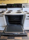 HOTPOINT 30 INCH FREESTANDING ELECTRIC RANGE COIL BURNERS 2 LARGE 2 SMALL SELF CLEANING OVEN HI LO BROIL OPTION WHITE WITH BLACK GLASS DOOR NO WINDOW LOCATED IN OUR PORTLAND OREGON APPLIANCE STORE SKU 24090