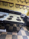 ROPER BY WHIRLPOOL 30 INCH FREESTANDING ELECTRIC RANGE COIL BURNERS 2 LARGE 2 SMALL SELF CLEANING OVEN BLACK GLASS OVEN DOOR ALMOND LOCATED IN OUR PORTLAND OREGON APPLIANCE STORE SKU 24099