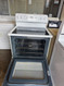 GE 30 INCH FREESTANDING GLASS TOP ELECTRIC RANGE 4 BURNER 2 LARGE 2 SMALL HI LO BROIL SETTING MANUAL CLEAN OVEN WHITE LOCATED IN OUR PORTLAND OREGON APPLIANCE STORE SKU 24101