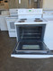 HOTPOINT 30 INCH FREESTANDING ELECTRIC RANGE COIL BURNERS 2 SMALL 2 LARGE HI LO BROIL SETTINGS SELF CLEANING OVEN WHITE LOCATED IN OUR PORTLAND OREGON APPLIANCE STORE SKU 24053