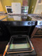 JENN-AIR 30 INCH SLIDE-IN GLASS TOP 5 BURNERS 1 TRIPLE 1 DUAL 2 SMALL CENTER WARMING BURNER RAPID PREHEAT CONVECTION WARMING DRAWER SELF CLEANING OVEN BLACK LOCATED IN OUR PORTLAND OREGON APPLIANCE STORE SKU 24146