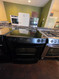 JENN-AIR 30 INCH SLIDE-IN GLASS TOP 5 BURNERS 1 TRIPLE 1 DUAL 2 SMALL CENTER WARMING BURNER RAPID PREHEAT CONVECTION WARMING DRAWER SELF CLEANING OVEN BLACK LOCATED IN OUR PORTLAND OREGON APPLIANCE STORE SKU 24146