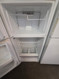 GE 16 CUBIC FOOT REFRIGERATOR TOP FREEZER WIRE SHELVES GLASS CRISPER CIVER 2 DRAWERS FULL WIDTH WIRE SHELF IN FREEZER WHITE LOCATED IN OUR POTLAND OREGON APPLIANCE STORE SKU 24151