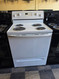 WHIRLPOOL 30 INCH FREESTANDING ELECTRIC RANGE COIL BURNERS 2 LARGE 2 SMALL SELF CLEANING OVEN WHITE LOCATED IN OUR PORTLAND OREGON APPLIANCE STORE SKU 24165