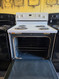 WHIRLPOOL 30 INCH FREESTANDING ELECTRIC RANGE COIL BURNERS 2 LARGE 2 SMALL SELF CLEANING OVEN WHITE LOCATED IN OUR PORTLAND OREGON APPLIANCE STORE SKU 24165