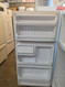HOTPOINT 14 CUBIC FOOT REFRIGERATOR TOP FREEZER WIRE SHELVES 2 CRISPER DRAWERS COSMETIC ISSUES ON THE DOORS SEE PIC WHITE LOCATED IN OUR PORTLAND OREGONAPPLIANCE STORE SKU 24176