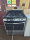 GE 30 Inch Freestanding PROPANE Gas Range with 5 Sealed Burners, 5 Cu. Ft. Oven Capacity, Storage Drawer, Continuous Grates, Self-Clean, Control Lock Capability, Center Oval Burner, and Precise Simmer Burner: Stainless Steel SKU 24198