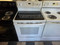 GE 30 INCH FREESTANDING ELECTRIC GLASS TOP RANGE 4 BURNERS 1 LARGE DUAL 1 LARGE 2 SMALL HI LO BROIL SETTING MANUAL CLEAN OVEN WHITE LOCATED IN OUR PORTLAND OREGON APPLIANCE STORE SKU 24200