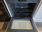 GE 30 INCH FREESTANDING ELECTRIC GLASS TOP RANGE 4 BURNERS 1 LARGE DUAL 1 LARGE 2 SMALL HI LO BROIL SETTING MANUAL CLEAN OVEN WHITE LOCATED IN OUR PORTLAND OREGON APPLIANCE STORE SKU 24200