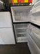 IKEA 18 CUBIC FOOT REFRIGERATOR BY WHIRLPOOL GLASS SHELVES GLASS CRISPER COVER WITH 2 DRAWERS STAINLESS FRONT BLACK  CABINET LOCATED IN OUR PORTLAND OREGON APPLIANCE STORE SKU 24223