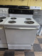 HOTPOINT 30 INCH FREE STANDING ELECTIC RANGE MANUAL CLEAN COIL BURNERS 3 SMALL 1 LARGE WHITE LOCATED IN OUR PORTLAND OREGON APPLIANCE STORE SKU 24259