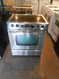 MAYTAG 30 INCH SLIDE IN ELECTRIC GLASS TOP RANGE 4 BURNER 1EXTRA LARGE POWER BOOST BURNER 1 LARGE 2 SMALL SELF CLEAN STAINLESS LOCATED IN OUR PORTLAND OREGON APPLIANCE STORE