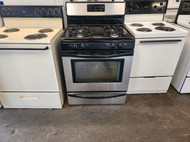 FRIGIDAIRE 30 INCH FREE STANDING 4 BURNER GAS RANGE SELF CLEANING OVEN DELAYED START OPTION  STOREAGE DRAWER BLACK LOCATED IN OUR PORTLAND OREGON APPLIANCE STORE SKU 16304