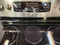 GE 30 INCH SMOOTH TOP FREE STANDING ELECTRIC RANGE 5 BURNER CENTER WARMING BURNER TRIPLE RIGHT FRONT BURNER BRIDGE BURNER AND 1 SMALL 2 CLEANING OPTIONS FOR OVEN WARMING DRAWER STAINLESS LOCATED IN OUR PORTLAND OREGON APPLIANCE STORE SKU 16309