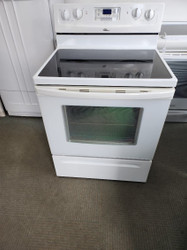 WHIRLPOOL GLASS TOP ELECTRIC RANGE 30 INCH FREE STANDING 4 BURNER 1 LARGE DUAL 1 LARGE 2 SMALL SELF CLEANING OVEN KEEP WARM SETTING DELAYED COOKING OPTION STORAGE  DRAWER WHITE LOCATED IN OUR PORTLAND OREGON APPLIANCE STORE SKU 16529