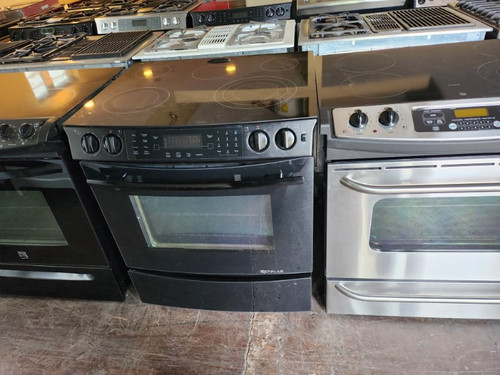 JENN-AIR 30 INCH SLIDE SMOOTH TOP ELECTRIC RANGE 5 BURNER 1 LARGE DUAL 1 MEDIUM 1 WARMING 2 SMALL CONVECTION WARMING DRAWER SELF CLEANING OVEN BLACK LOCATED IN OUR PORTLAND OREGON APPLIANCE STORE SKU 16974