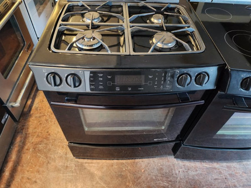 JENN-AIR 30 INCH SLIDE-IN GAS RANGE 4 BURNER WITH  CONVECTION SELF CLEANING OVEN WARMING DRAWER BLACK LOCATED IN OUR PORTLAND OREGON APPLIANCE STORE SKU 17441