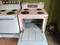 GE PINK VINTAGE 30 INCH FREE STANDING ELECTRIC RANGE COIL BURNERS 3 SMALL 1 LARGE STORAGE DRAWER COSMETIC ISSUE ON TOP SEE PICS LOCATED IN OUR PORTLAND OREGON APPLIANCE STORE SKU 17580