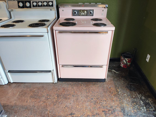 GE PINK VINTAGE 30 INCH FREE STANDING ELECTRIC RANGE COIL BURNERS 3 SMALL 1 LARGE STORAGE DRAWER COSMETIC ISSUE ON TOP SEE PICS LOCATED IN OUR PORTLAND OREGON APPLIANCE STORE SKU 17580