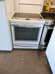 WHIRLPOOL 30 INCH SLIDE IN SMOOTH TOP ELECTRIC RANGE CONVECTION AQUA LIFT SELF  CLEANING OVEN 5 BURNER CENTER WARMING BURNER WHITE LOCATED IN OUR PORTLAND OREGON APPLIANCE STORE SKU 17642