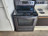 FRIGIDAIRE 30 INCH FREE STANDING SMOOTH TOP ELECTRIC RANGE 5 BURNER 1 LARGE DUAL 1 LARGE CENTER WARMING BURNER 2 SMALL STEAM CLEAN OVEN STOREAGE DRAWER BLACK STAINLESS LOCATED IN OUR PORTLAND OREGON APPLIANCE STORE SKU 17727