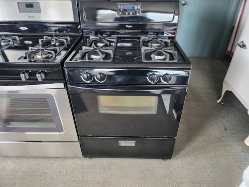 WHIRLPOOL 30 INCH FREE STANDING PROPANE GAS RANGE 4 BURNER MANUAL CLEAN OVEN BLACK LOCATED IN OUR PORTLAND OREGON APPLIANCE STORE SKU 17736