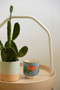 A DOPO 8 OZ HANDPAINTED "FLOWER" CERAMIC CANDLE - CACTUS FLOWER, AD0803