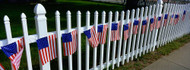 American Flags Hanging on a Picket Fence