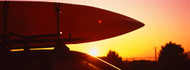 Kayak on a Car Roof at Sunset