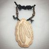 Hand-carved double prayer feathers shell gorget by artist Dan Townsend