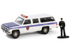 1985 GMC Suburban 2500 New York City Transit Police Department White with Blue Stripes and Police Officer Figure The Hobby Shop Series 16 1/64 Diecast Model Car Greenlight 97160C