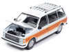 1985 Dodge Caravan Van White with Woodgrain Side Panels Mighty Minivans Series 1/64 Diecast Model Car Auto World 64442-AWSP167A