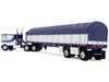 Peterbilt 352 COE 110 Sleeper and 53 Wilson Roadbrute Flatbed Trailer with Covered Wagon White with Blue Stripes 1/64 Diecast Model DCP/First Gear 60-2057