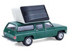 1990 Chevrolet Suburban Green with Modern Rooftop Camper The Great Outdoors Series 4 1/64 Diecast Model Car Greenlight 38080E