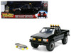 1985 Toyota SR5 Pickup Truck Black with Marty's Skateboard Back to the Future 1985 Movie Hollywood Rides Series 1/24 Diecast Model Car Jada 36479