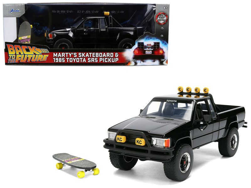 1985 Toyota SR5 Pickup Truck Black with Marty's Skateboard Back to the Future 1985 Movie Hollywood Rides Series 1/24 Diecast Model Car Jada 36479