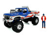 1979 Ford F-250 Monster Truck Bigfoot USA 250 Tribute Blue with USA Flag Graphics and Bob Chandler Standing Figure Kings of Crunch Series 1/18 Diecast Model Car Greenlight 13726