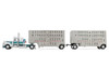 Peterbilt 389 with 36" Flat Top Sleeper and 28' Wilson Silverstar Double Livestock Trailers White with Dark Teal Stripes 1/64 Diecast Model First Gear 60-2343