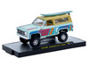 1975 GMC Jimmy Sierra 4x4 Light Blue with Graphics and Tan Top with Surfboard Limited Edition to 10560 pieces Worldwide 1/64 Diecast Model Car M2 Machines 31500-HS86