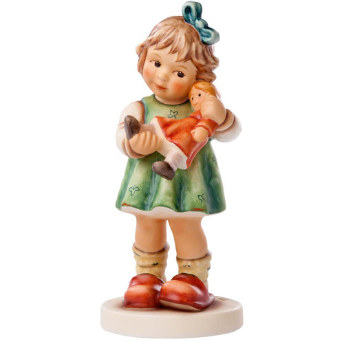 M.I. Hummel 'A Little TLC' (HUM 2334/A) featuring a young girl holding a doll with a bandaged leg. Close-up of the girl's nurturing expression and the tiny bandage on the doll's leg.