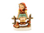 M.I. Hummel 'Just Resting' (HUM 112 3/0) showing a young girl with a headscarf and a basket resting on a wooden fence.